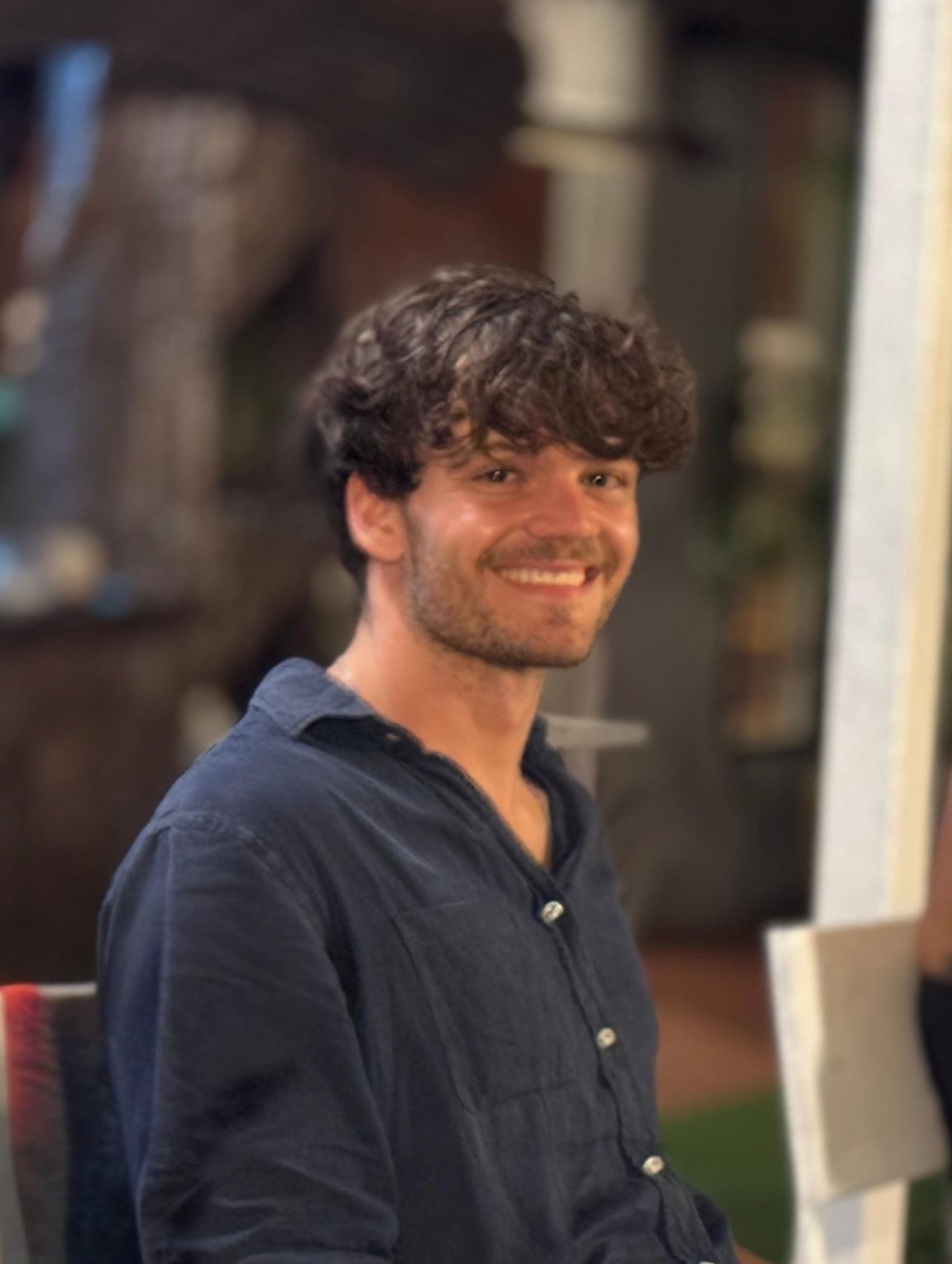Till — founder of tilltomorrow.tech, smiling, warm evening light